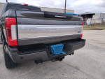 Rear view of a 2017 Ford F250 Platinum truck showing clean title and wear details, ideal for buyers looking for trucks.