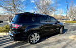 2016 GMC Acadia Denali in black, showcasing sleek design, ready for winter with AWD and snow tires.