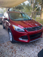 Red 2014 Ford Escape S FWD parked outside, showcasing its clean exterior and modern design.