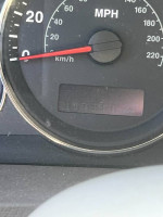 Odometer reading of a 2007 Jeep Grand Cherokee at 107,847 miles in a tow company impound sale.