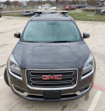 Front view of a 2013 GMC Acadia SLT with clean exterior, new inspection, and roof racks.