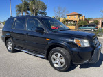 2006 Honda Pilot EX-L in black with leather seats, moonroof, and clean condition, ideal family SUV for sale.