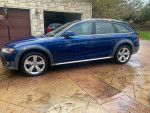 2013 Audi A4 Allroad Premium Plus in blue, parked on a driveway with signs of wear and nearly new tires.