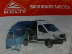 2001 Ford Econoline camper van with blue body and white top, featuring a backroads shelter setup for outdoor adventures.