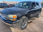 2004 GMC Yukon, black SUV with 20-inch rims, clean title, 89k miles, needs tire and interior detailing.