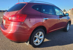 2011 Nissan Rogue SL AWD in red with new winter tires, showcasing smooth design and clean maintenance records.