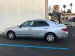 2005 Honda Accord LX FWD in silver, parked outside, showcasing its clean condition and original mileage.