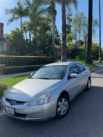 2005 Honda Accord LX FWD in silver for sale with clean title and original mileage of 150,000.