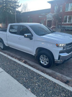 2021 Chevrolet Silverado 1500 LT 4WD parked, showcasing pristine condition and 51,000 miles driven.