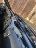 Interior view of a 1998 Dodge Ram 1500 truck dashboard, showing wear and tear.