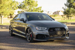 2019 Audi RS3 in Daytona Gray Pearl Effect parked in a scenic outdoor setting