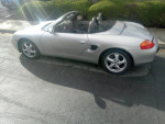 1998 Porsche Boxster convertible Silver with automatic transmission parked on street
