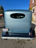 Rear view of a restored 1930 Plymouth Sedan Hot Rod with California license plate PLY1930