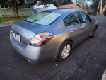 2012 Nissan Altima S model in silver, showing rear view with clean body and almost new tires.