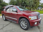 2010 INFINITI QX56 SUV in red with clean exterior, 4WD, and third-row seating.
