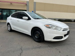 2015 Dodge Dart with 109,000 miles parked outside, showing clean exterior and good tires, great first car option.