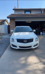 Front view of a well-maintained 2013 Cadillac ATS Performance RWD parked in a driveway.