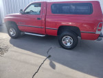 1995 Dodge Ram 1500 SLT in red, V8 4x4, one owner with clean title, parked in Albuquerque NM.