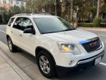 2012 GMC Acadia SLE in excellent condition, featuring three rows for up to seven passengers.