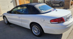 2006 Chrysler Sebring Convertible in white with a new transmission and low miles parked in a driveway