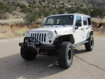 2007 Jeep Wrangler with 92,000 miles, equipped for off-road with lift kit and winch.
