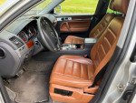 Interior view of a 2005 Volkswagen Touareg V8, featuring leather seats and dashboard with gauges.