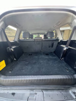 Interior view of a Lexus GX 460 Luxury Edition with spacious cargo area and black seating.