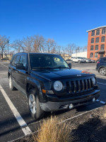 2012 Jeep Patriot AWD in excellent condition parked in a lot, showcasing its reliability and new parts.