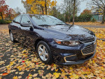 2018 Chevrolet Malibu LT FWD with clean title and 51,000 miles, parked among colorful autumn leaves.