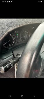 Interior view of a 2006 Lexus IS 250 showcasing dashboard and steering wheel features.