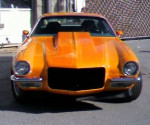 1970 Chevrolet Camaro Z-28 in vibrant orange, showcasing its classic design and rebuilt performance.