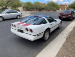 1990 Chevrolet Corvette coupe parked on a street, featuring new engine and exterior paint.