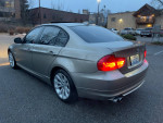 2011 BMW 328xi with 116,000 miles parked, showcasing its clean exterior and stylish design.