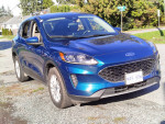 2020 Ford Escape SE in blue, 1.5L turbo engine, parked outdoors showcasing sleek design and features.