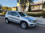 2013 Volkswagen Tiguan S 4Motion AWD parked in a pristine environment, showcasing its immaculate exterior and design.
