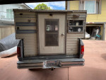 Rear view of a 1989 Dodge Ram 4X4 turbo diesel truck showing its unique camper setup.