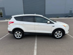 2013 Ford Escape SE FWD in white with alloy wheels parked outdoors, showcasing its sleek design and condition.
