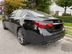 2018 Infiniti Q50 Red Sport 400 AWD, fully loaded, parked on the street with stylish alloy rims.