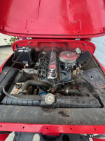 1973 Jeep CJ5 engine with new transmission and parts, showcasing restoration needs and features.