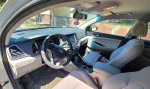 Interior view of a 2018 Hyundai Tucson with modern dashboard and leather seats, available for sale.