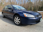 2005 Honda Accord EX-L V6 with sunroof, leather seats, and alloy wheels parked on a scenic road.