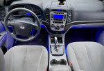 Interior view of a 2009 Hyundai Santa Fe with modern dashboard and comfortable seating.
