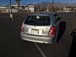 2003 Mazda Protege 5 in silver, parked with minor body blemishes, available for $1500, 135k miles