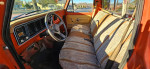 Interior view of a classic 1976 Ford F250, showcasing vintage seating and dashboard design.