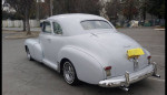 1947 Chevy Fleetmaster coupe with classic design and gray primer finish parked outdoors