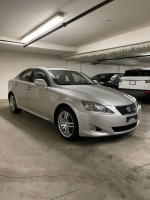 2007 Lexus IS 250 RWD in silver with sunroof parked in an underground garage