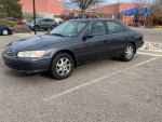 2000 Toyota Camry parked, 132,000 miles, features 6-cylinder engine, automatic transmission, and clean title.