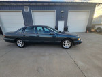 1996 Chevrolet Impala in amazing condition with gray leather seats, original paint, and only 63,000 miles