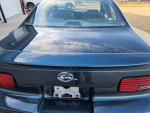 Rear view of a 1996 Chevrolet Impala in excellent condition with original paint and gray leather seats.