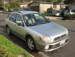 2003 Subaru Impreza Outback Sport, silver with AWD, parked on the street, in excellent condition with new tires.